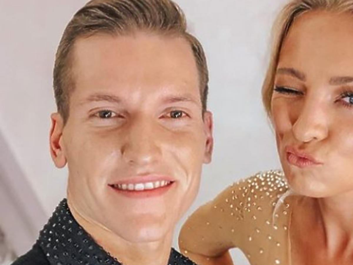 Barbara Kurdej-Szatan w czerwonej sukience, Jacek Jeschke w czarnej koszuli